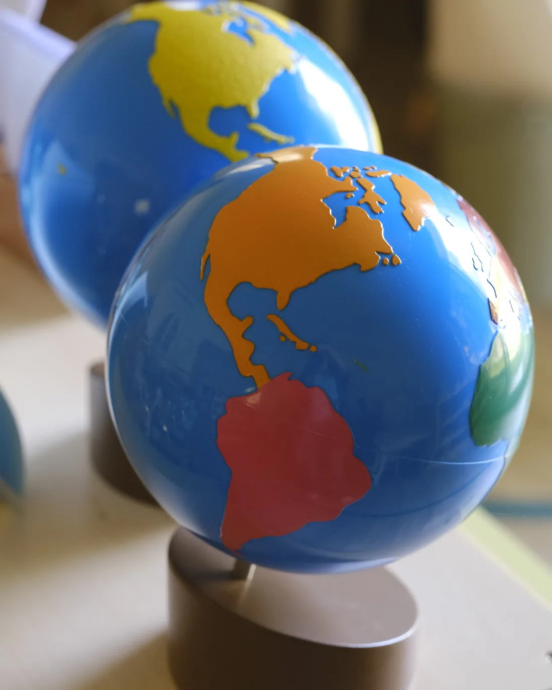 Montessori continent globes children use to explore geography and the wider world