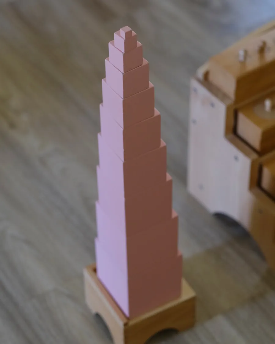 The Montessori pink tower on the classroom floor